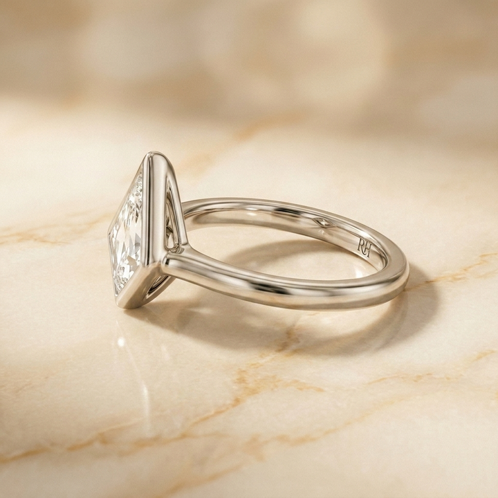 The Agnes Select bezel solitaire kite engagement ring in 18k white gold — side profile — RockHer