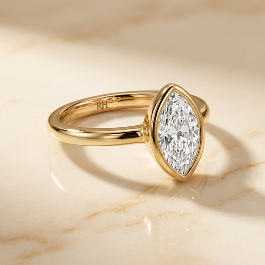 Agnes Marquise bezel solitaire engagement ring setting in 18K Yellow Gold — alt-angle hero — RockHer