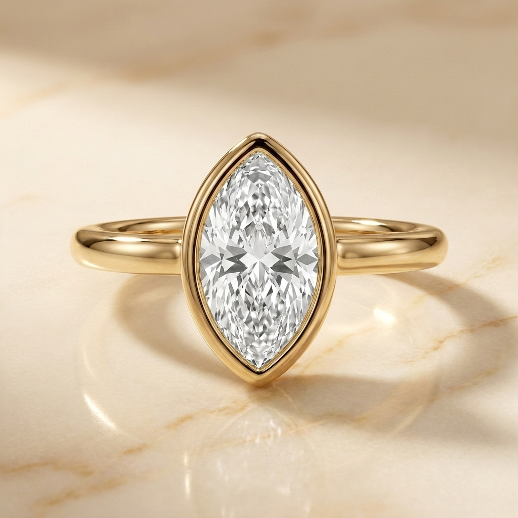The Agnes Select bezel solitaire marquise engagement ring in 18k yellow gold — front view — RockHer