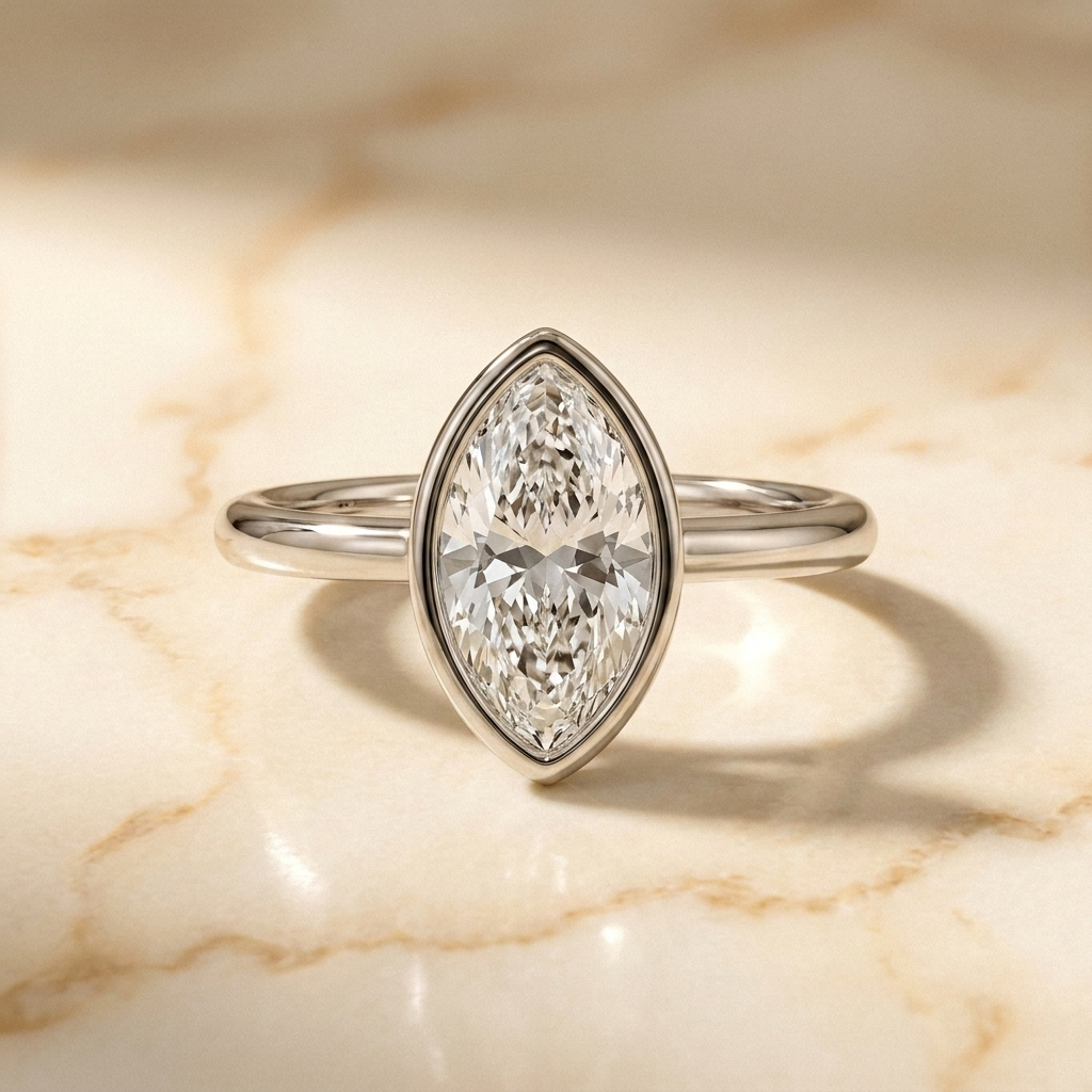 The Agnes bezel solitaire marquise engagement ring setting in 18k white gold — front view — RockHer
