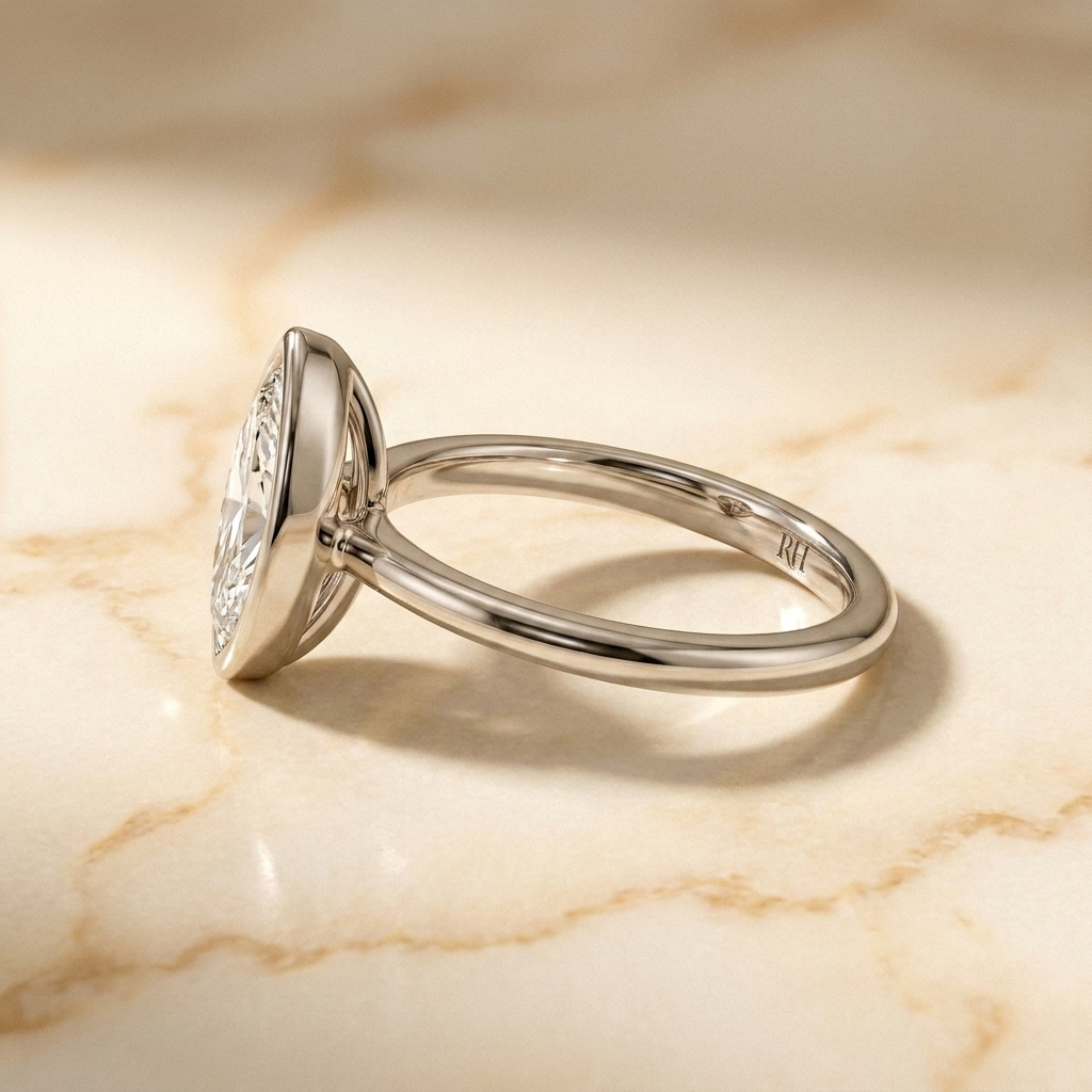 The Agnes Select bezel solitaire marquise engagement ring in 18k white gold — side profile — RockHer