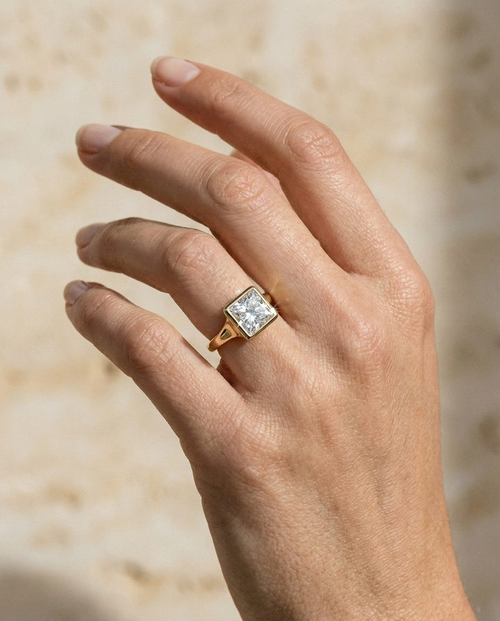Agnes Princess bezel solitaire engagement ring setting in 18K Yellow Gold — on hand — RockHer