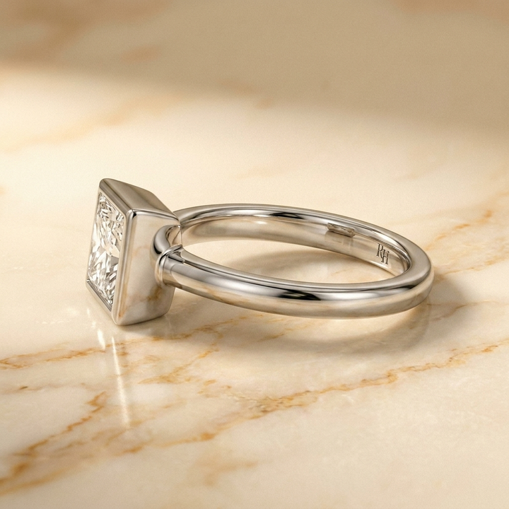 The Agnes bezel solitaire princess engagement ring setting in 18k white gold — side profile — RockHer