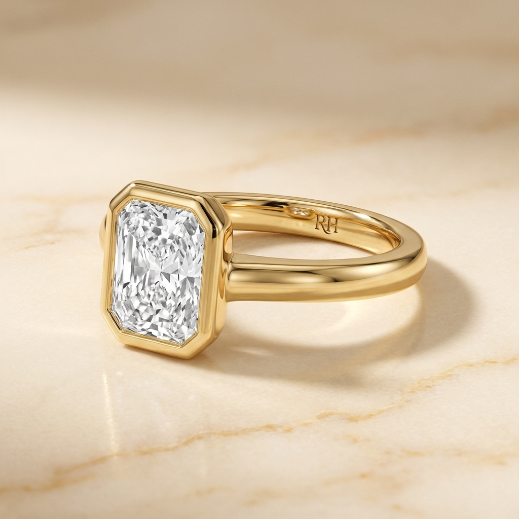 The Agnes Select bezel solitaire radiant engagement ring in 18k yellow gold — alt-angle hero — RockHer