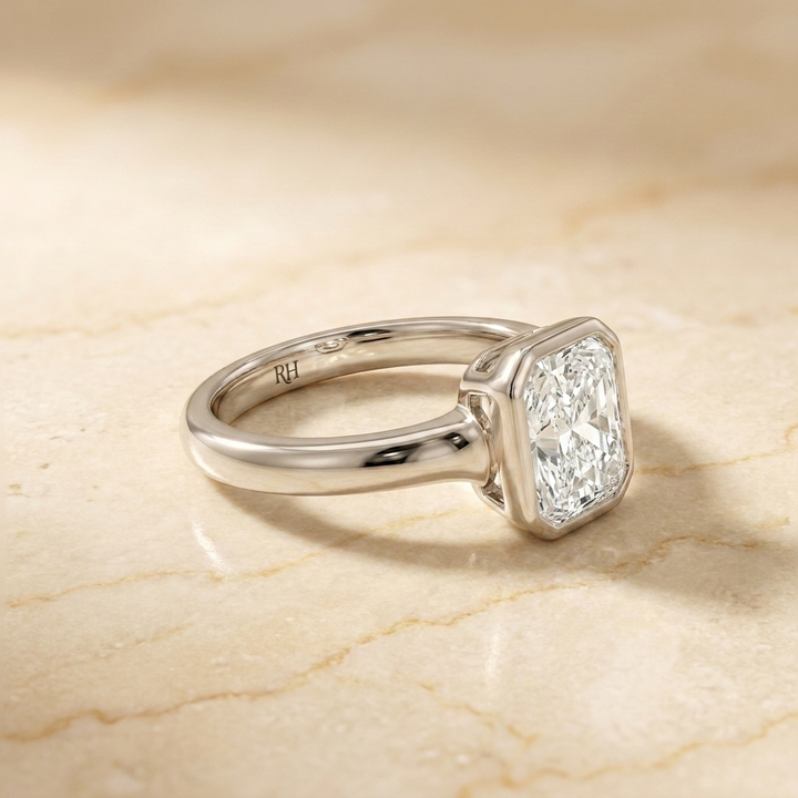 The Agnes Select bezel solitaire radiant engagement ring in platinum — side profile — RockHer