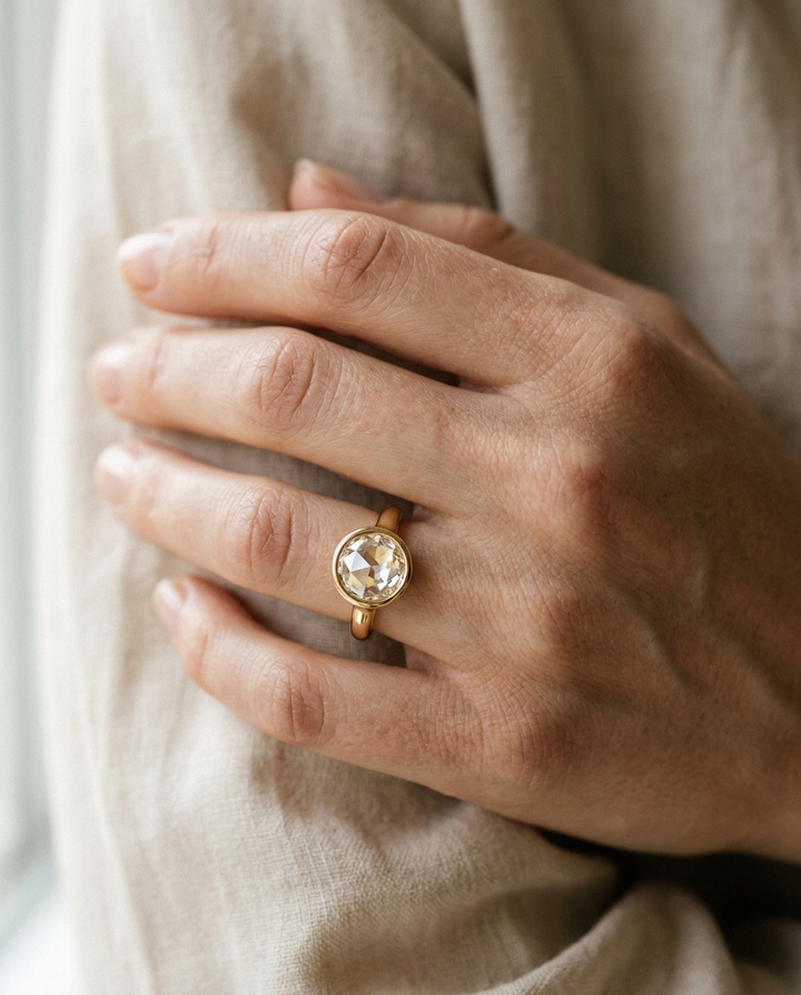 The Agnes Select bezel solitaire rose cut engagement ring in 18k yellow gold — on hand — RockHer