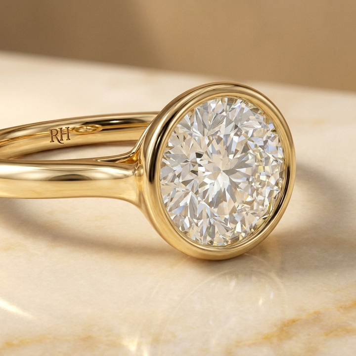 The Agnes Select bezel solitaire round brilliant engagement ring in 18k yellow gold — construction detail — RockHer