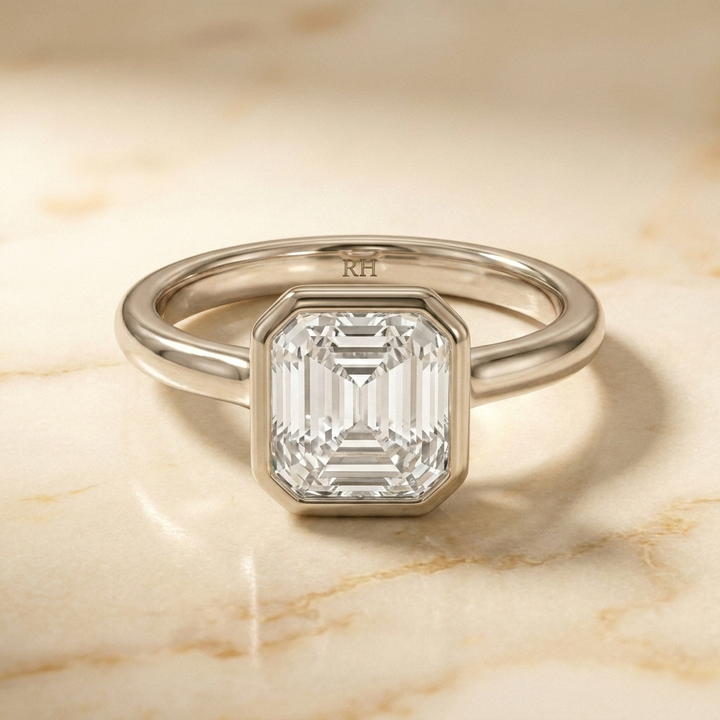The Agnes Select bezel solitaire square emerald engagement ring in 18k white gold — front view — RockHer