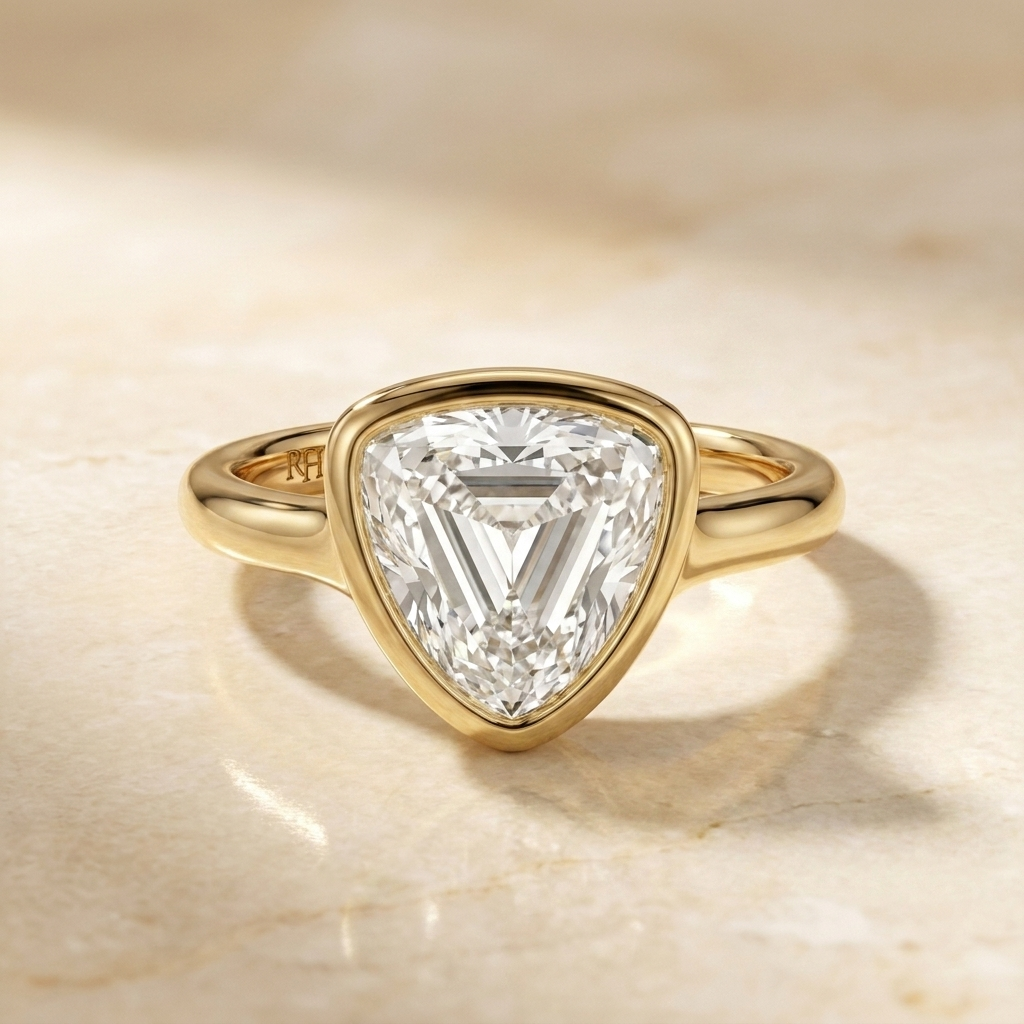 The Agnes Select bezel solitaire shield engagement ring in 18k yellow gold — front view — RockHer