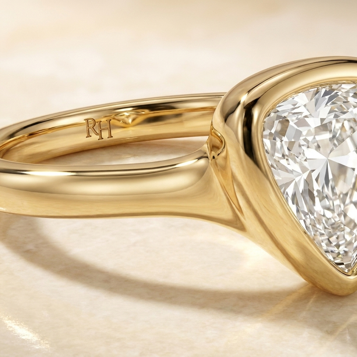 The Agnes Select bezel solitaire shield engagement ring in 18k yellow gold — construction detail — RockHer