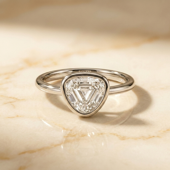 The Agnes Select bezel solitaire shield engagement ring in platinum — front view — RockHer