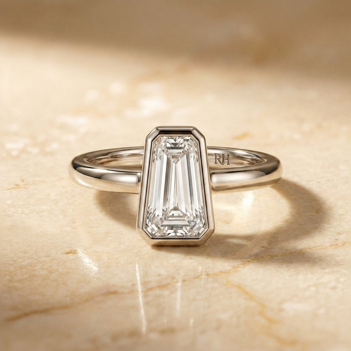 The Agnes Select bezel solitaire tapered baguette engagement ring in platinum — front view — RockHer