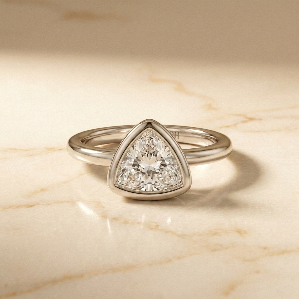 The Agnes Select bezel solitaire trillion engagement ring in 18k white gold — front view — RockHer