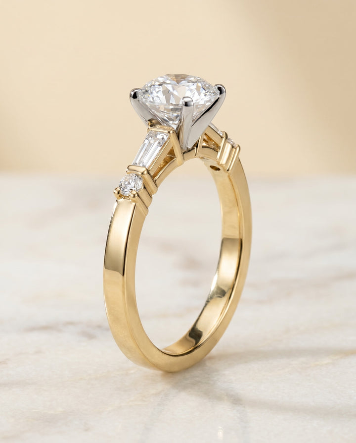 Round Brilliant, Baguette and Round Side Stone, in 18K Yellow Gold – side profile | RockHer