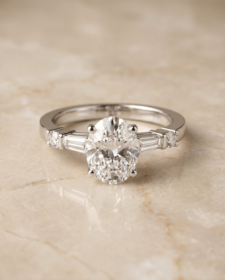 Diana baguette and round side stone engagement ring in 18K white gold with oval lab diamond — RockHer