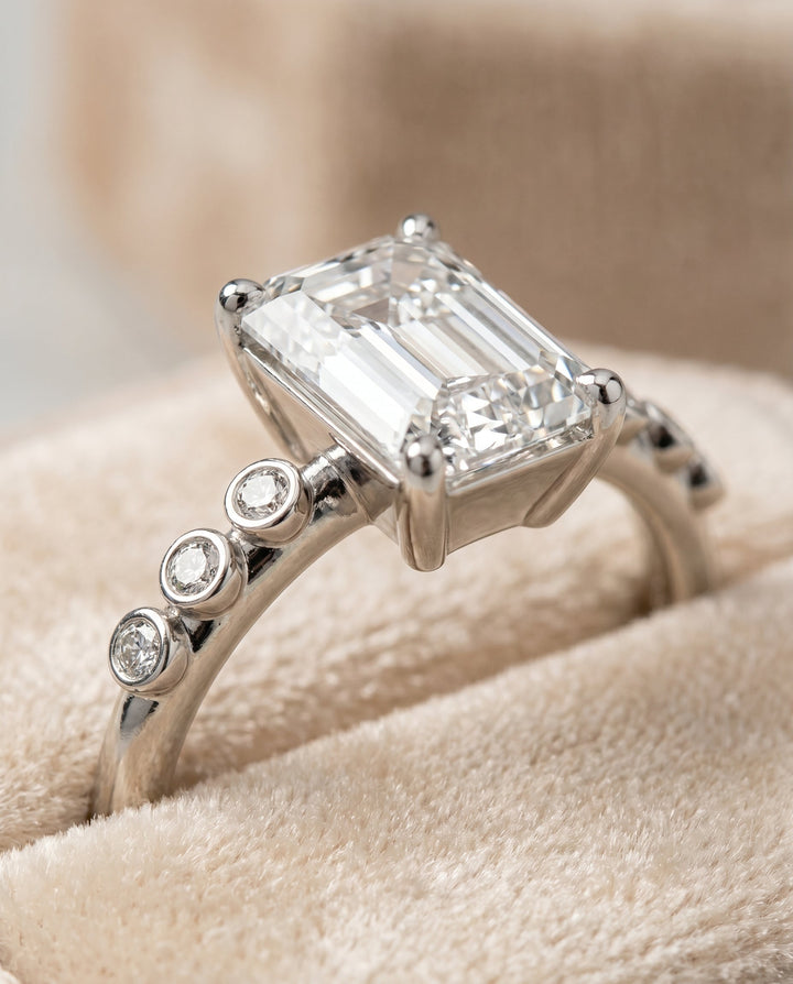 The Peggy Bezel Solitaire Engagement Ring Setting for Emerald Cut Diamonds in Platinum