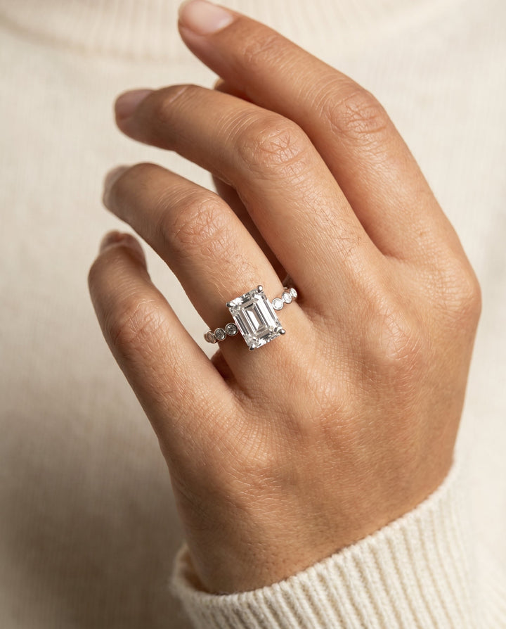 The Peggy Bezel Solitaire Engagement Ring Setting for Emerald Cut Diamonds in Platinum