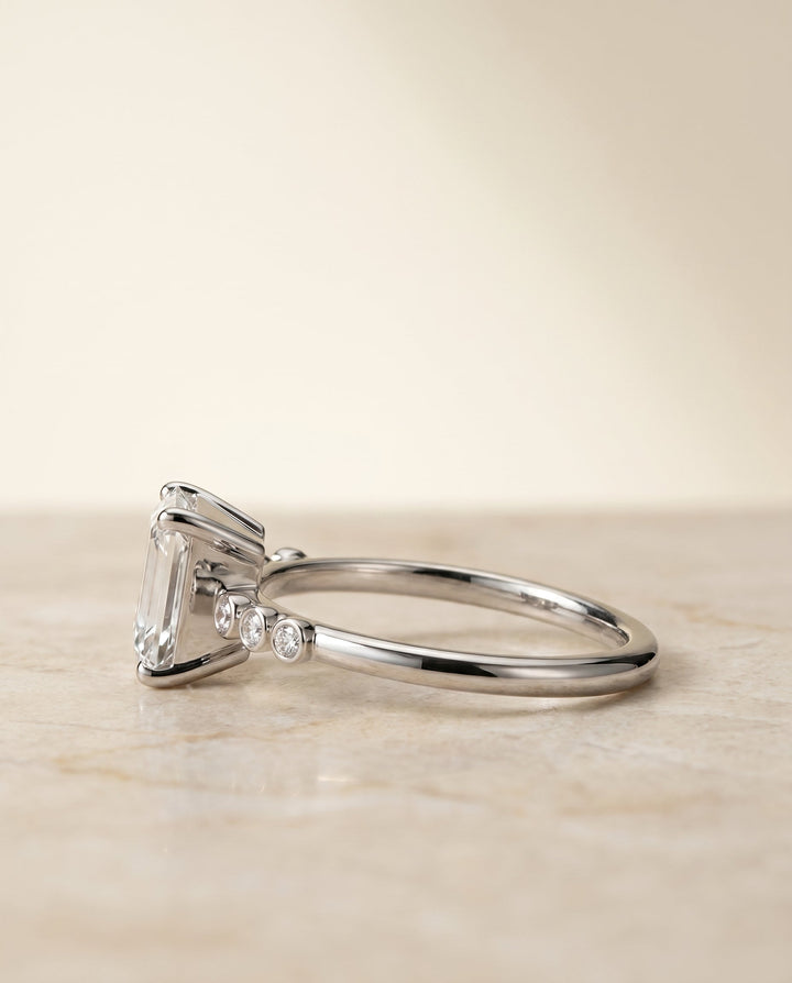 The Peggy Bezel Solitaire Engagement Ring Setting for Emerald Cut Diamonds in Platinum
