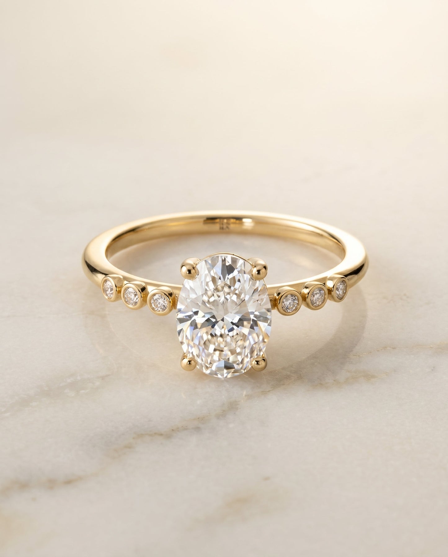 Peggy Select Bezel Accent Solitaire Oval in 18K Yellow Gold – view 1
