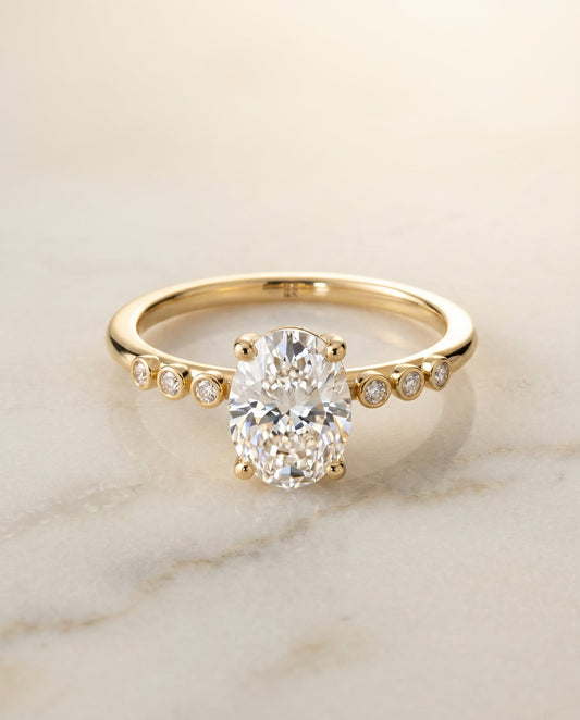 Peggy Select Bezel Accent Solitaire Oval in 18K Yellow Gold – view 1