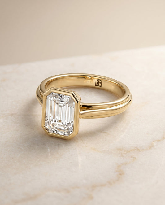 European Cut, Bezel Cathedral Solitaire Emerald, in 18K Yellow Gold – angled view | RockHer