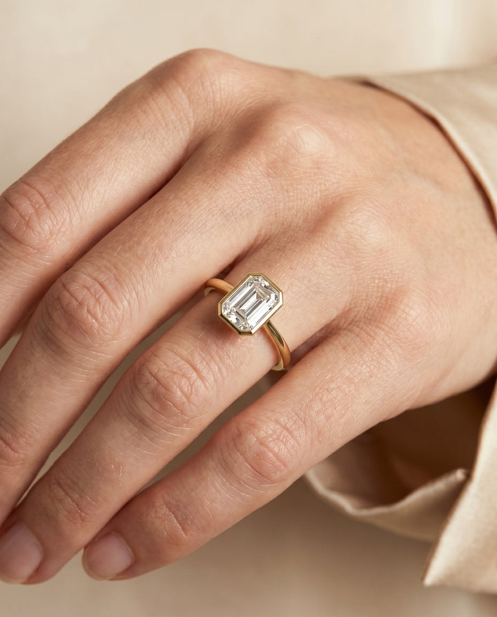 European Cut, Bezel Cathedral Solitaire Emerald, in 18K Yellow Gold – lifestyle shot | RockHer