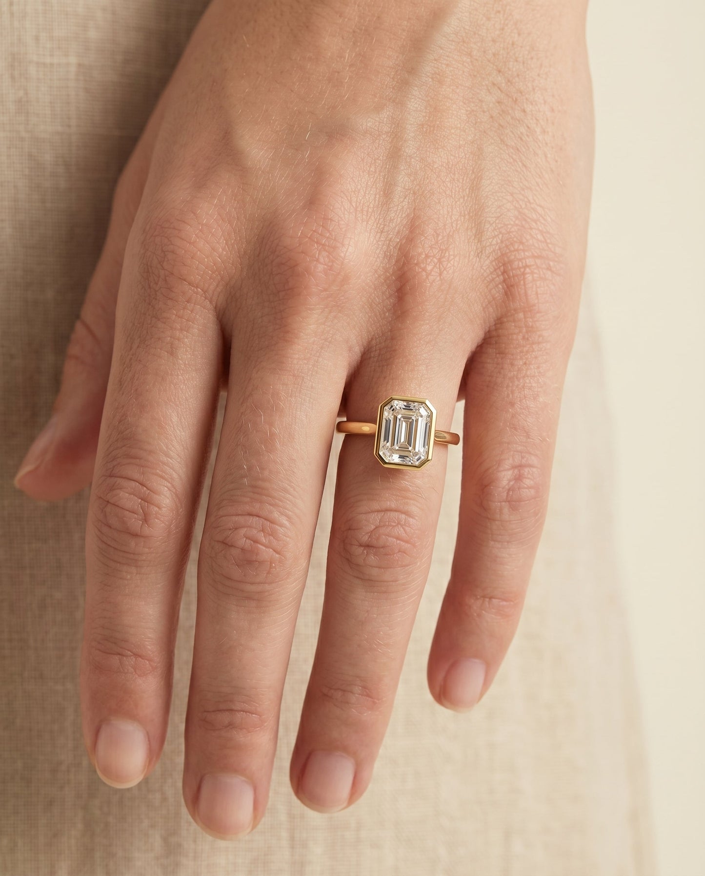 European Cut, Bezel Cathedral Solitaire Emerald, in 18K Yellow Gold – lifestyle shot | RockHer