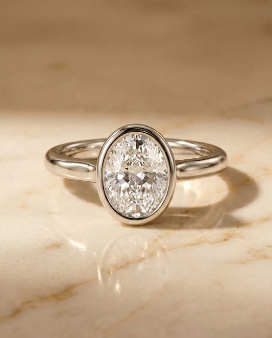 The Agnes Bezel Solitaire Engagement Ring Setting for Oval Diamonds in Platinum | RockHer