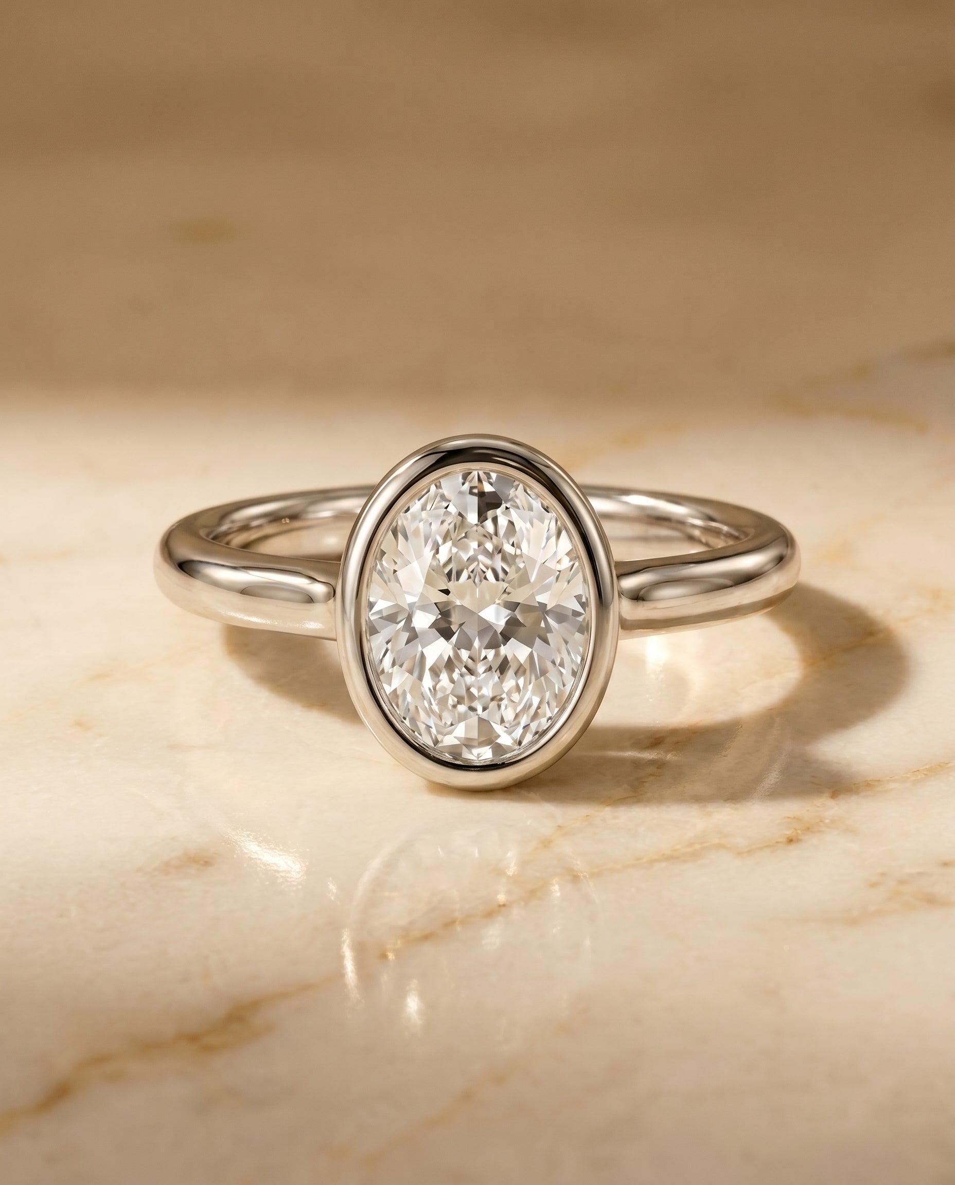 The Agnes Bezel Solitaire Engagement Ring Setting for Oval Diamonds in Platinum | RockHer