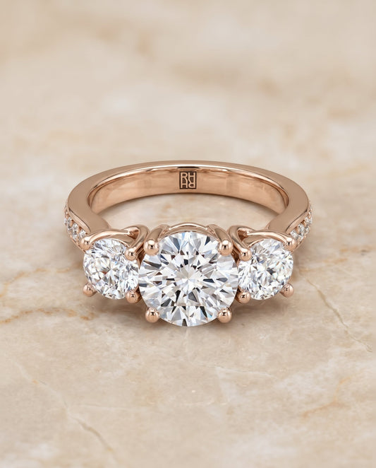 Avery Select Channel Pave Three Stone Solitaire in 14K Rose Gold – view 1