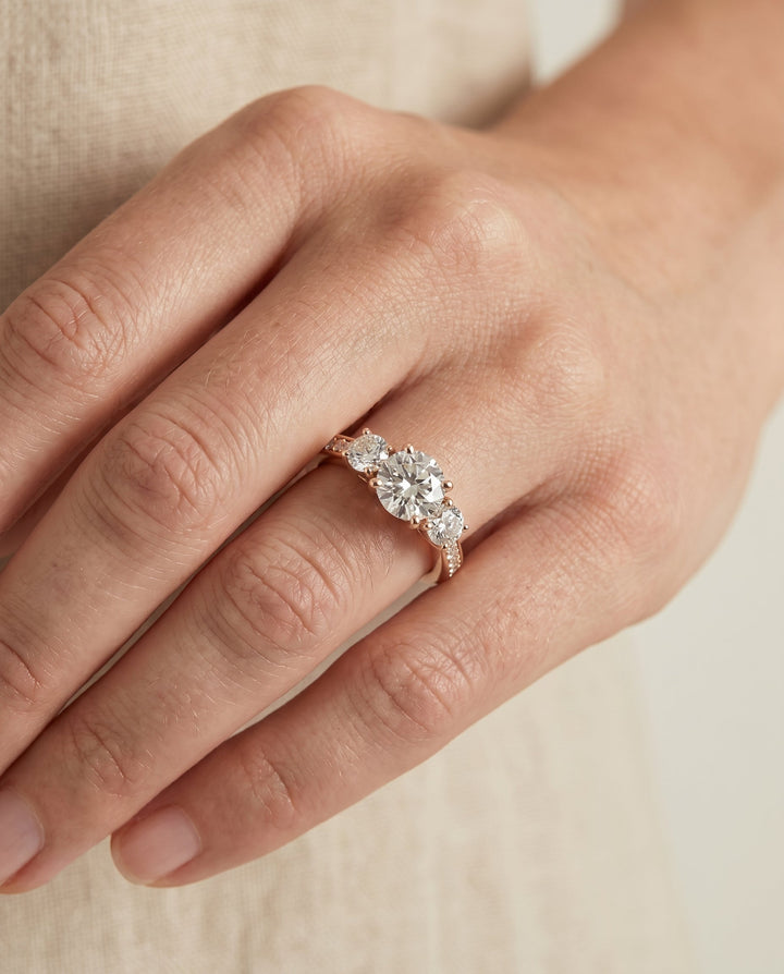 Avery Select Channel Pave Three Stone Solitaire in 14K Rose Gold – view 3