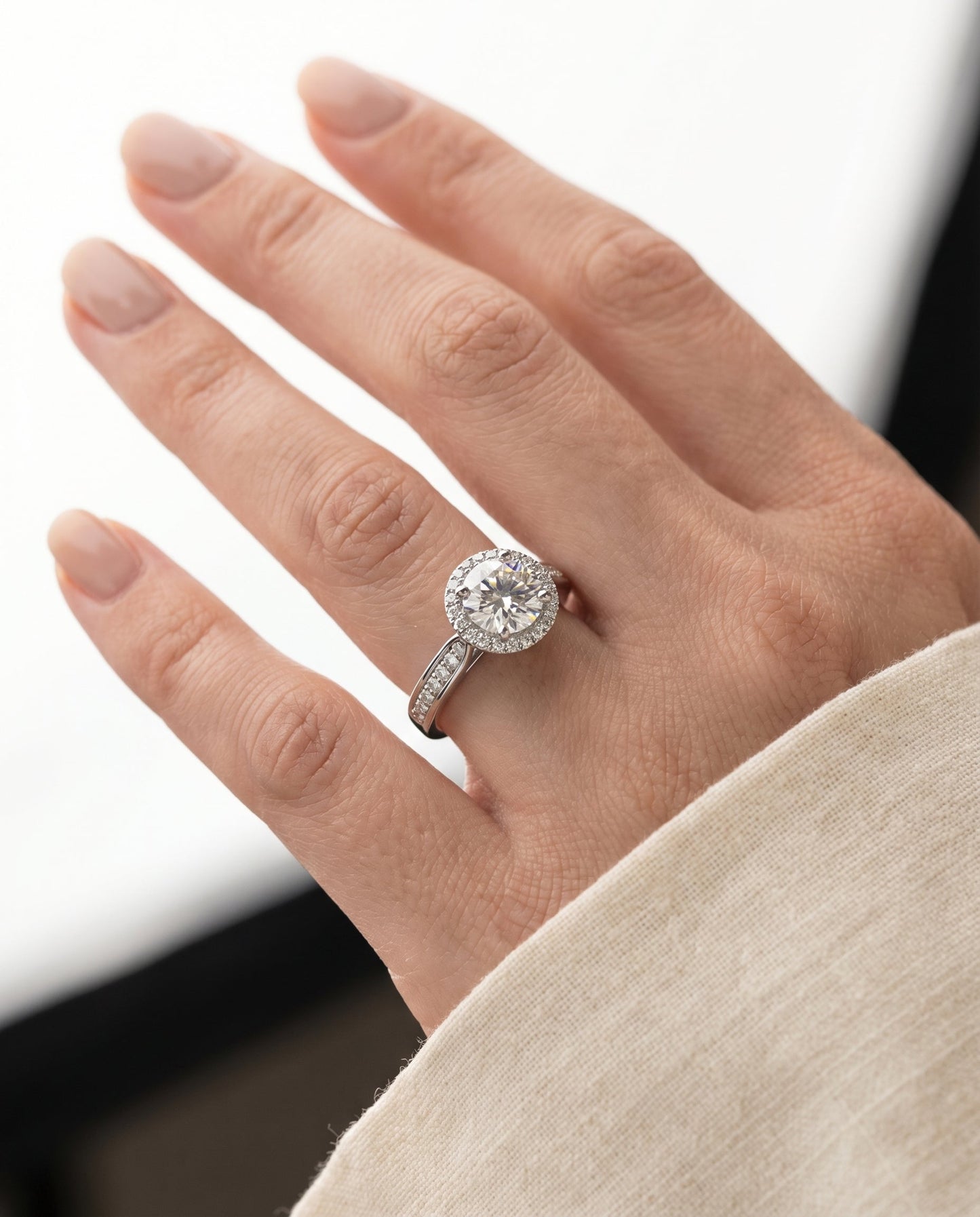 Round Brilliant, Channel Row Pavé Halo, in Platinum, prong setting – lifestyle shot | RockHer
