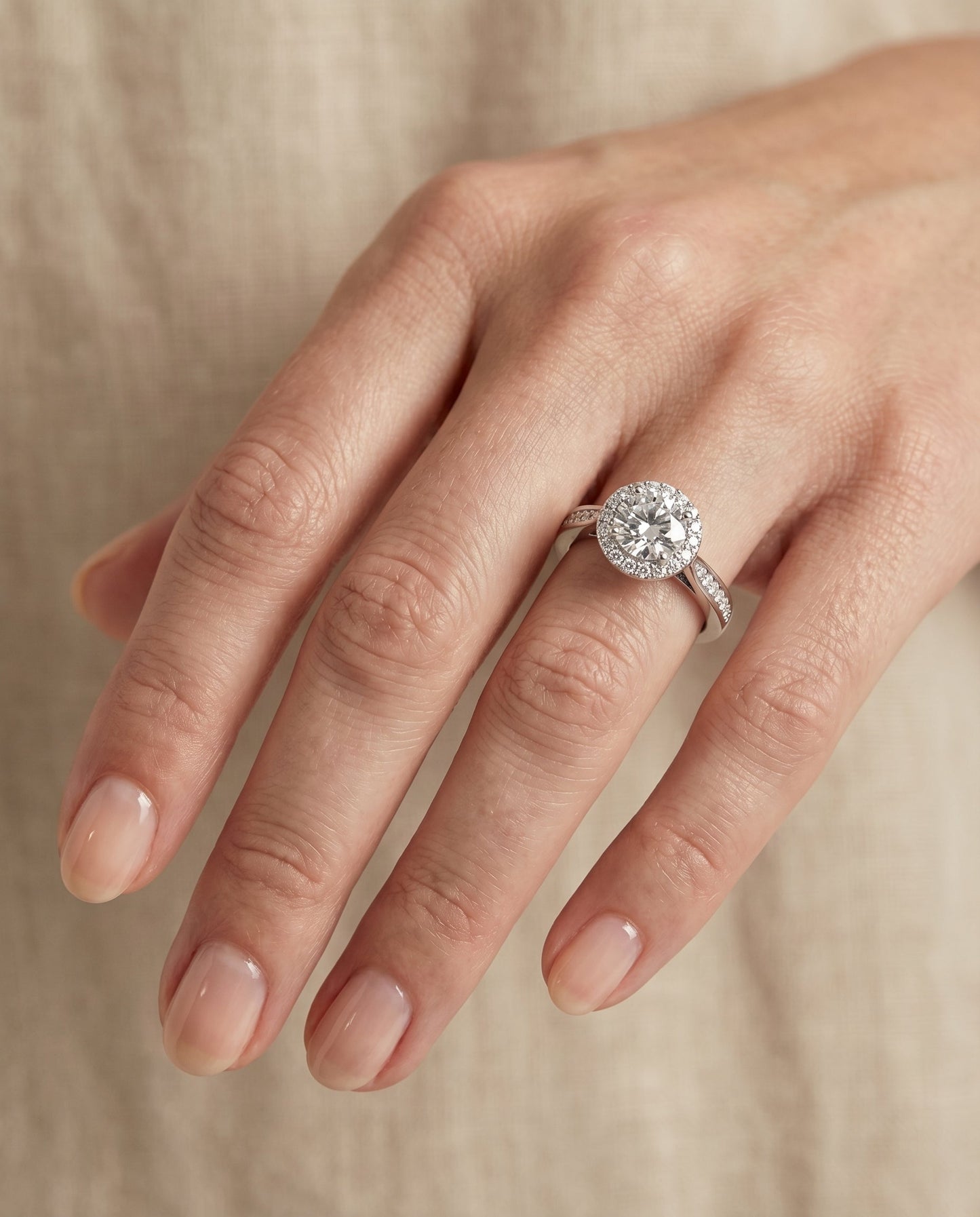 Round Brilliant, Channel Row Pavé Halo, in Platinum, prong setting – lifestyle shot | RockHer