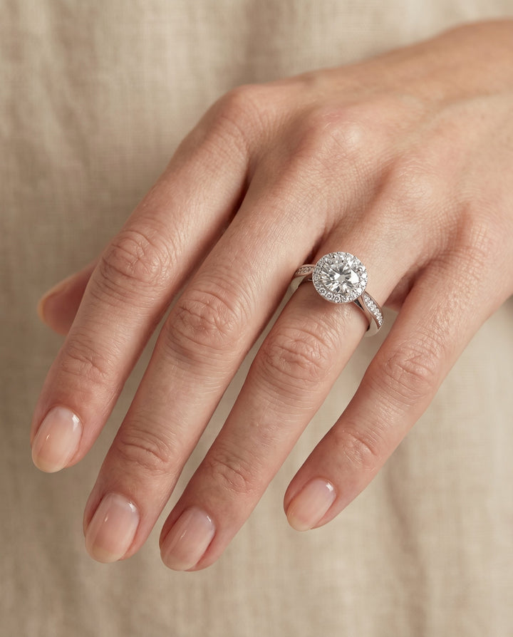 Round Brilliant, Channel Row Pavé Halo, in Platinum, prong setting – lifestyle shot | RockHer