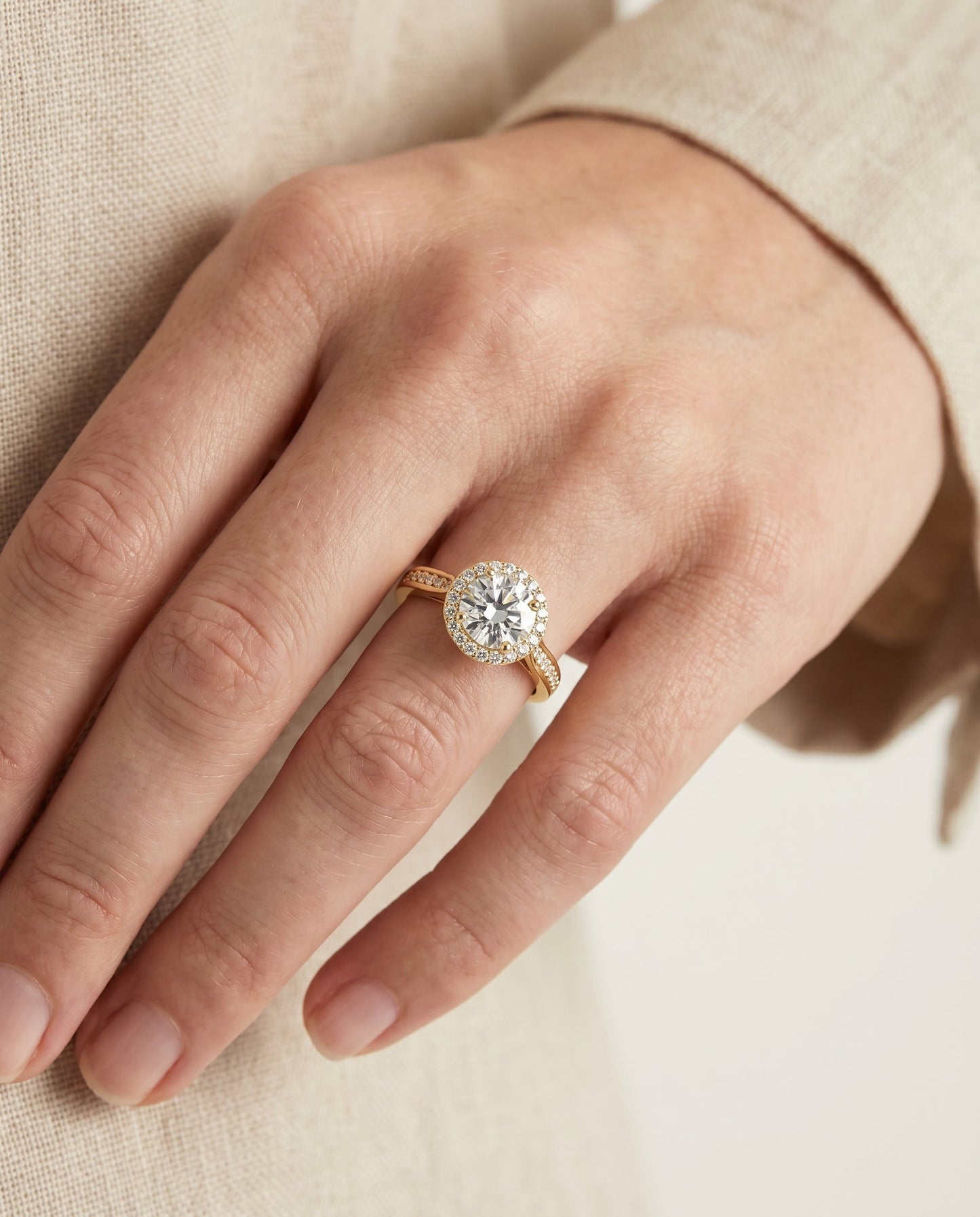 Round Brilliant, Channel Row Pavé Halo, in 18K Yellow Gold, prong setting – lifestyle shot | RockHer