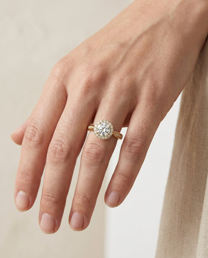 Round Brilliant, Channel Row Pavé Halo, in 18K Yellow Gold, prong setting – lifestyle shot | RockHer