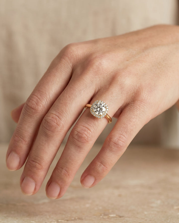 Round Brilliant, Classic Prong Diamond Halo, in 18K Yellow Gold, pave setting – lifestyle shot | RockHer
