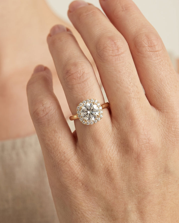 Round Brilliant, Classic Prong Diamond Halo, in 18K Yellow Gold, pave setting – lifestyle shot | RockHer