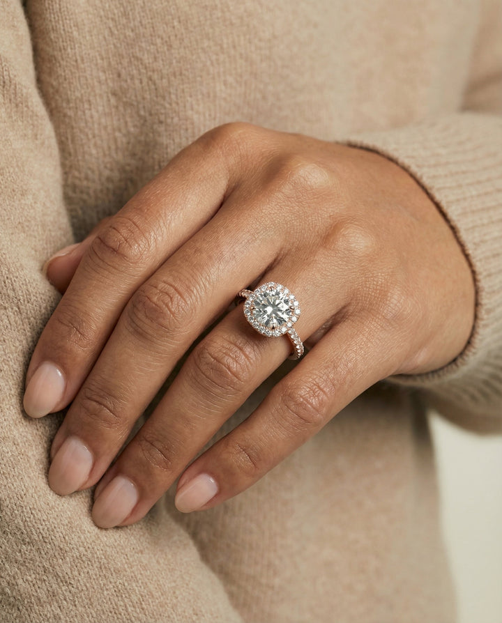 Round Brilliant, Classic Prong Halo, in 14K Rose Gold, pave setting – lifestyle shot | RockHer