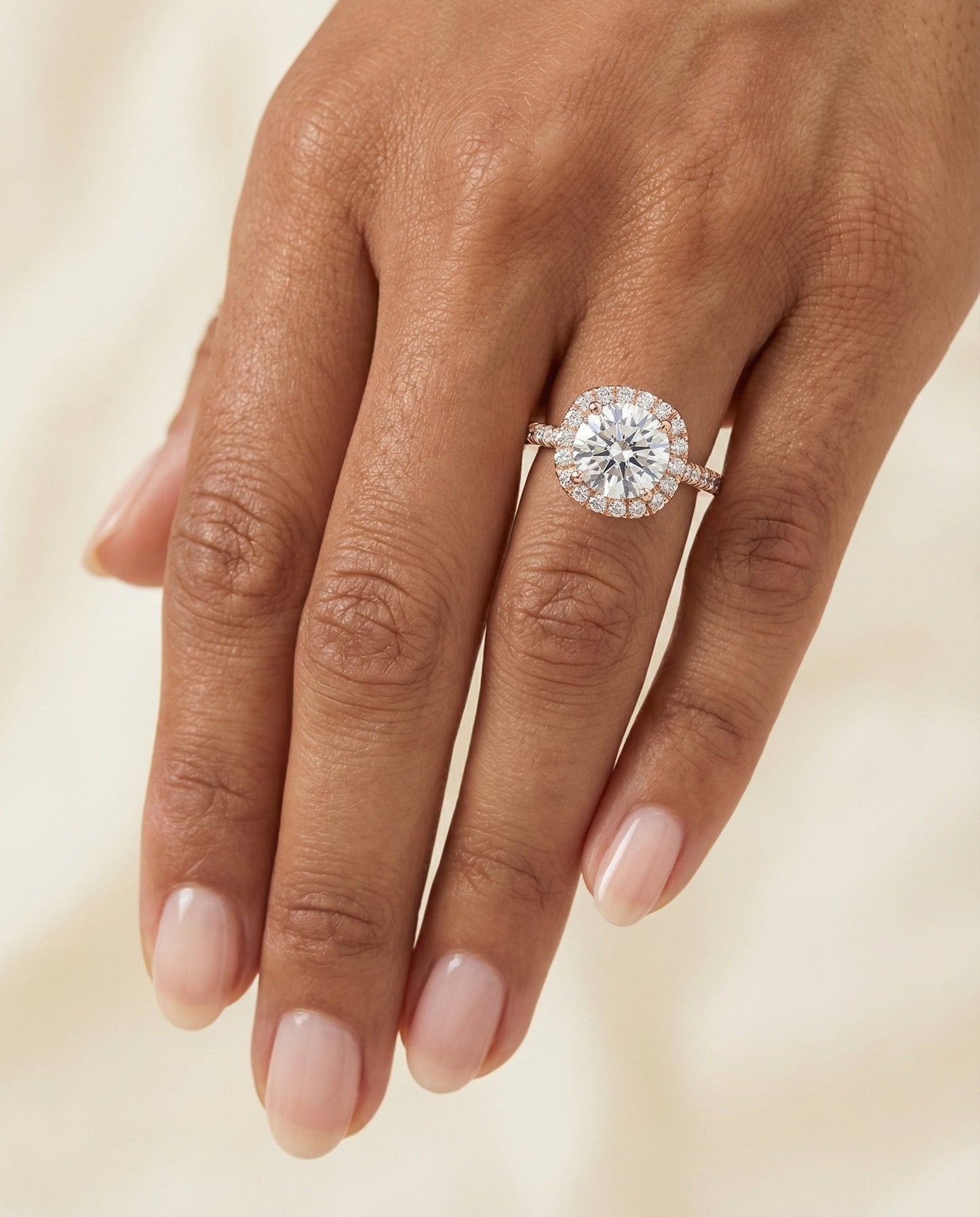 Round Brilliant, Classic Prong Halo, in 14K Rose Gold, pave setting – lifestyle shot | RockHer