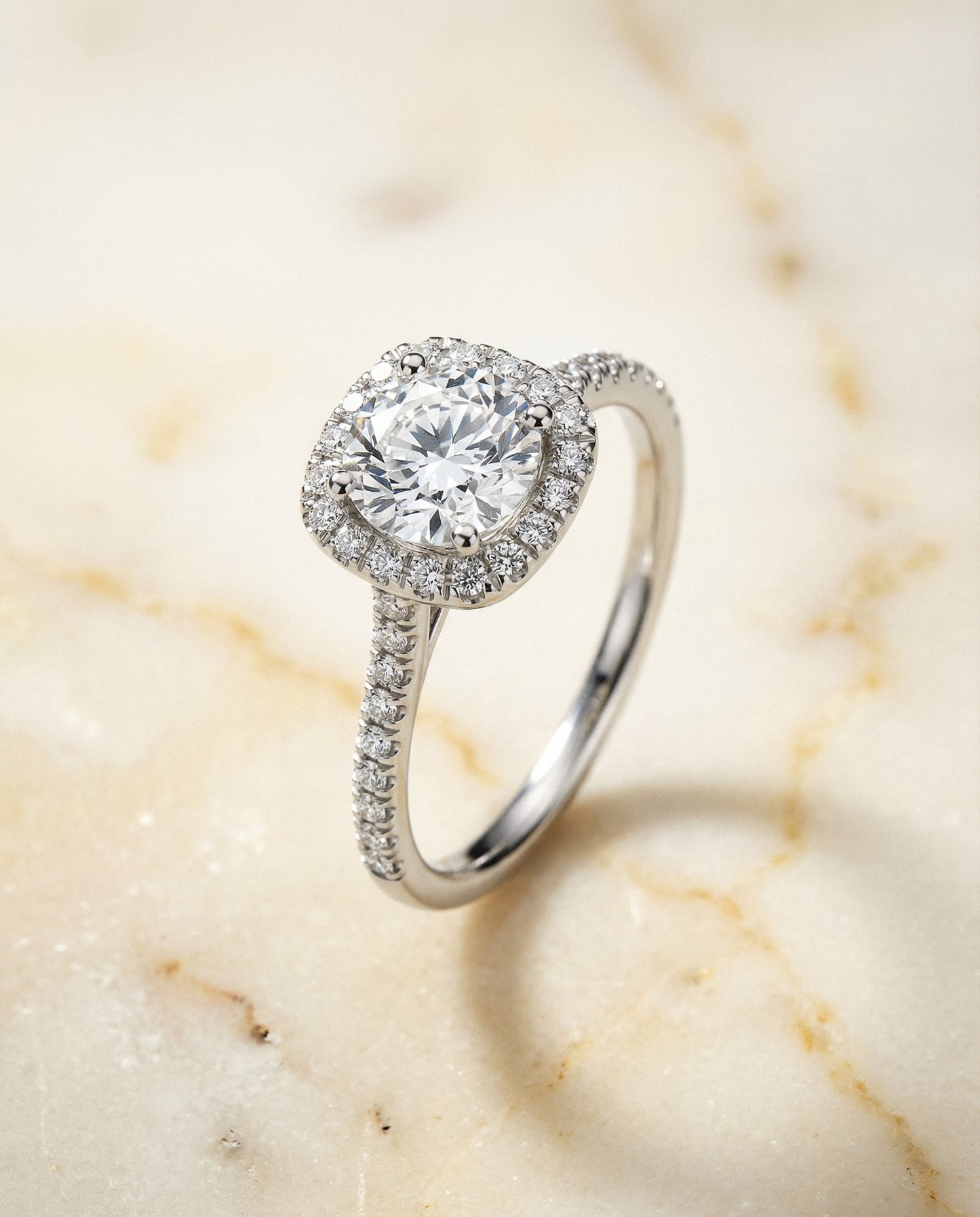 Round Brilliant, Classic Prong Halo, in Platinum, pave setting – angled view | RockHer