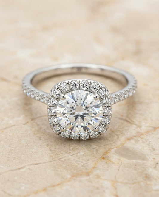 Round Brilliant, Classic Shared Prong Halo Round, in Platinum, pave setting – angled view | RockHer