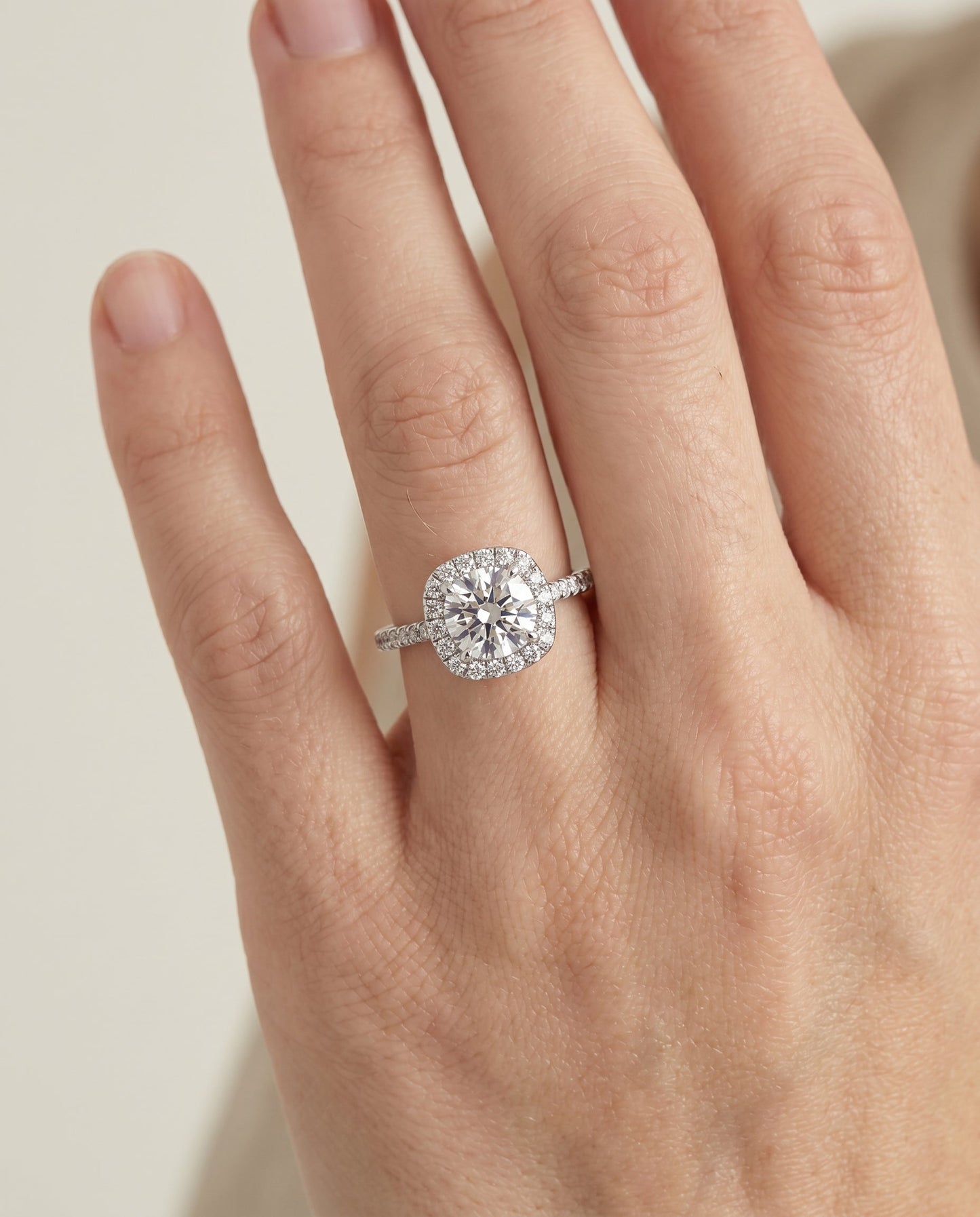 Round Brilliant, Classic Shared Prong Halo Round, in Platinum, pave setting – lifestyle shot | RockHer