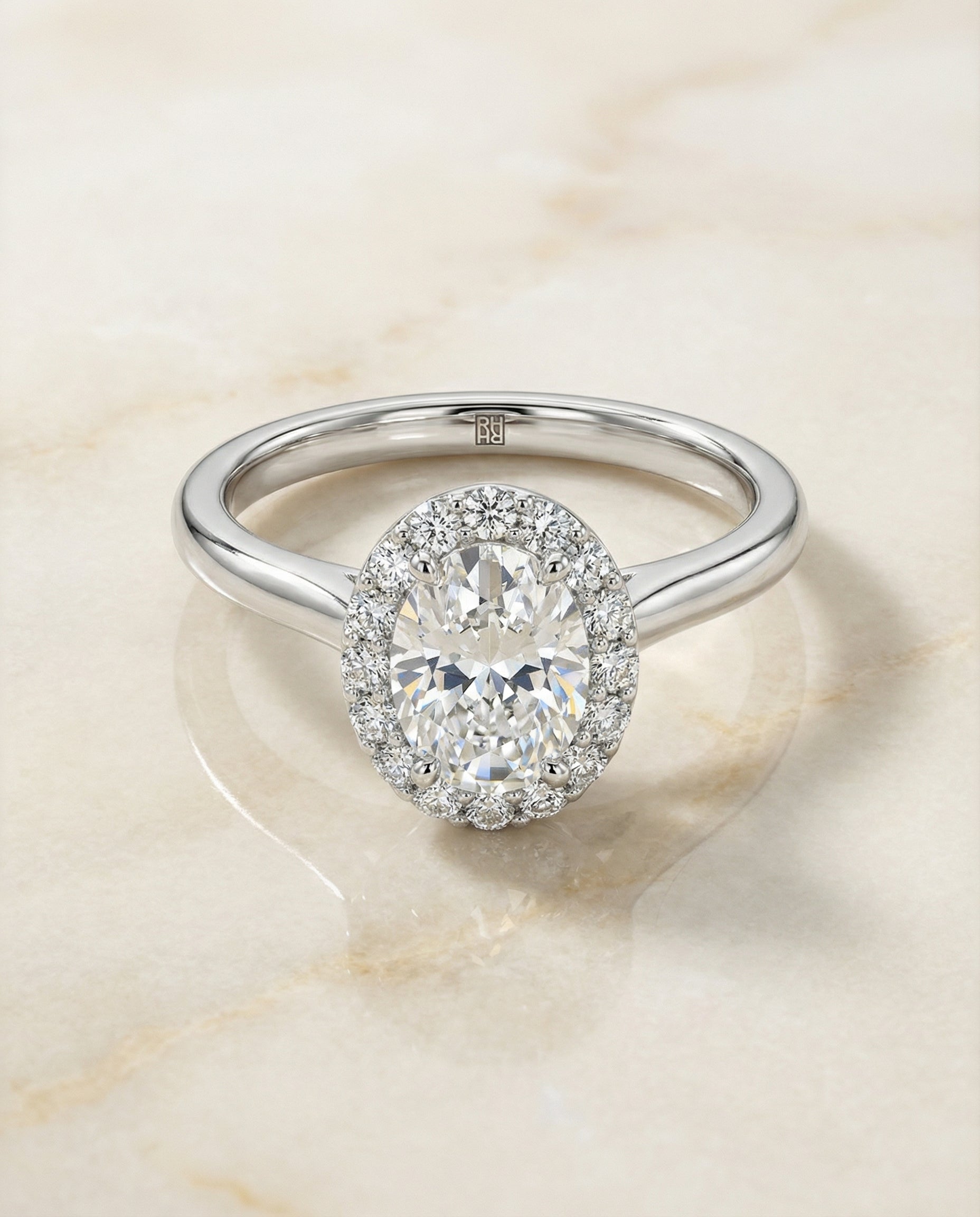 Classic Shared Prong Halo Oval, in Platinum, pave setting – angled view | RockHer