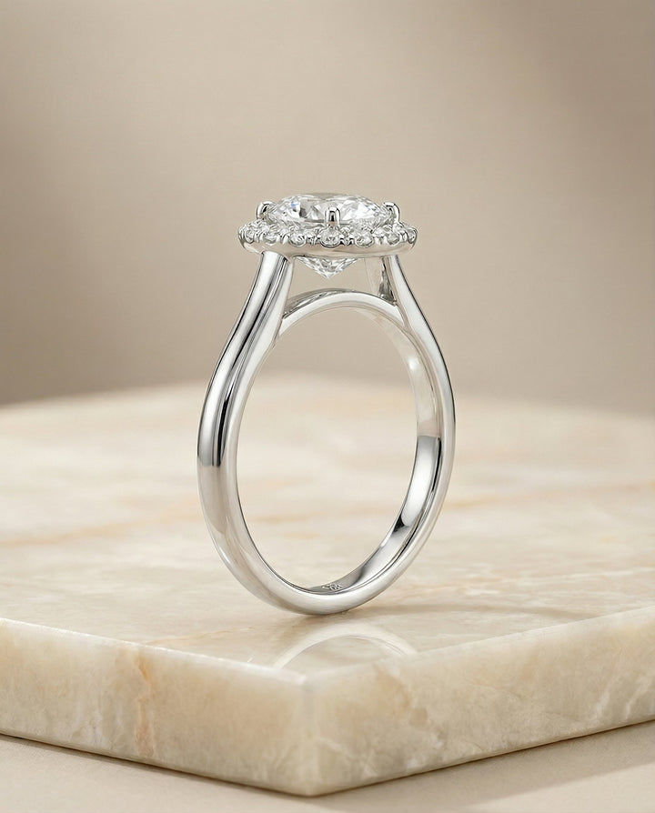 Classic Shared Prong Halo Oval, in Platinum, pave setting – side profile | RockHer