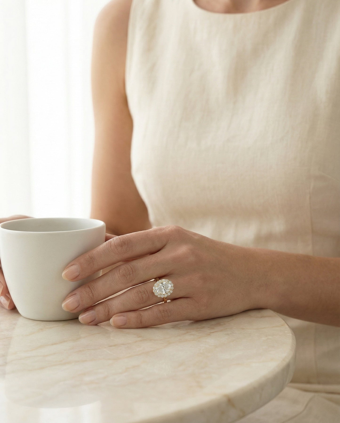 Classic Shared Prong Halo Oval, in 18K Yellow Gold, pave setting – lifestyle shot | RockHer