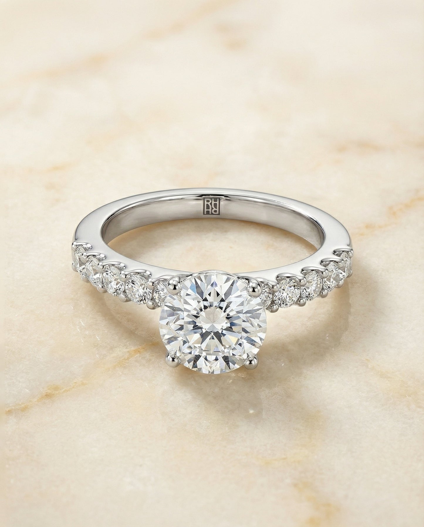 Round Brilliant, Classic Shared Prong Linear Pavé, in Platinum – angled view | RockHer