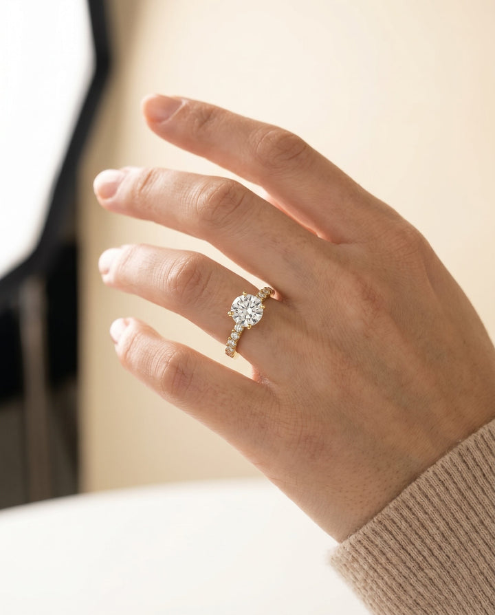Round Brilliant, Classic Shared Prong Linear Pavé, in 18K Yellow Gold – lifestyle shot | RockHer