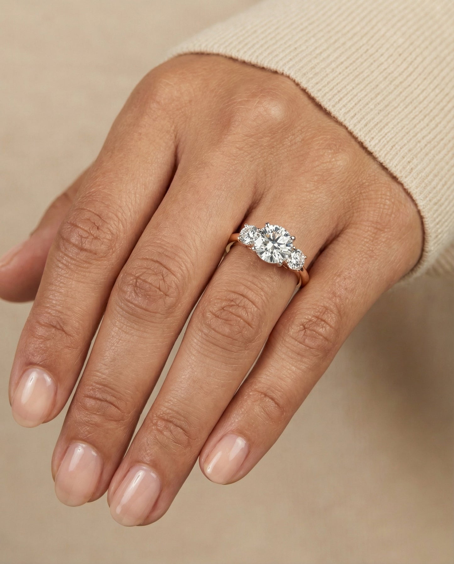 Round Brilliant, Classic Three Stone Round, in 14K Rose Gold, prong setting – lifestyle shot | RockHer