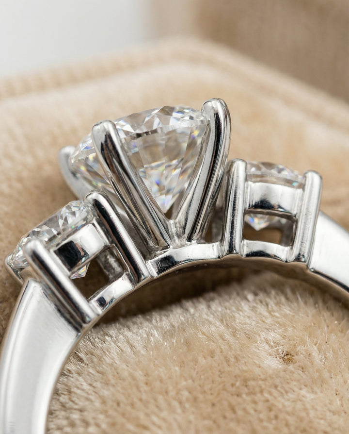 Round Brilliant, Classic Three Stone Round, in Platinum, prong setting – detail view | RockHer